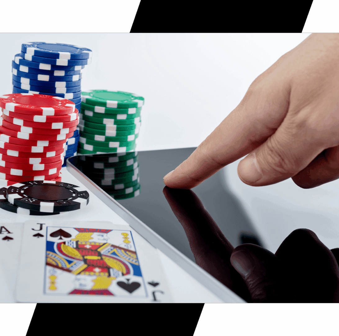 Poker chips, cards, and a touchscreen device.